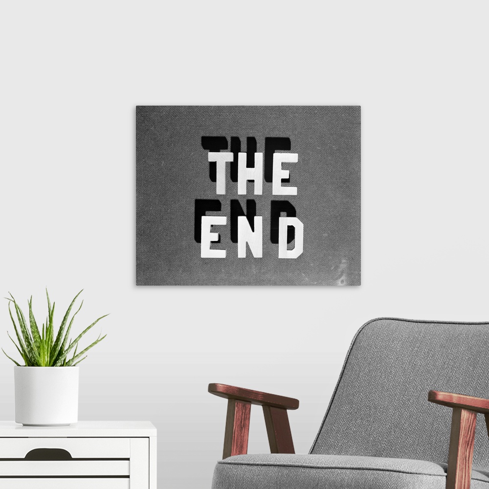 A modern room featuring 1930's The End - Retro Movie Title