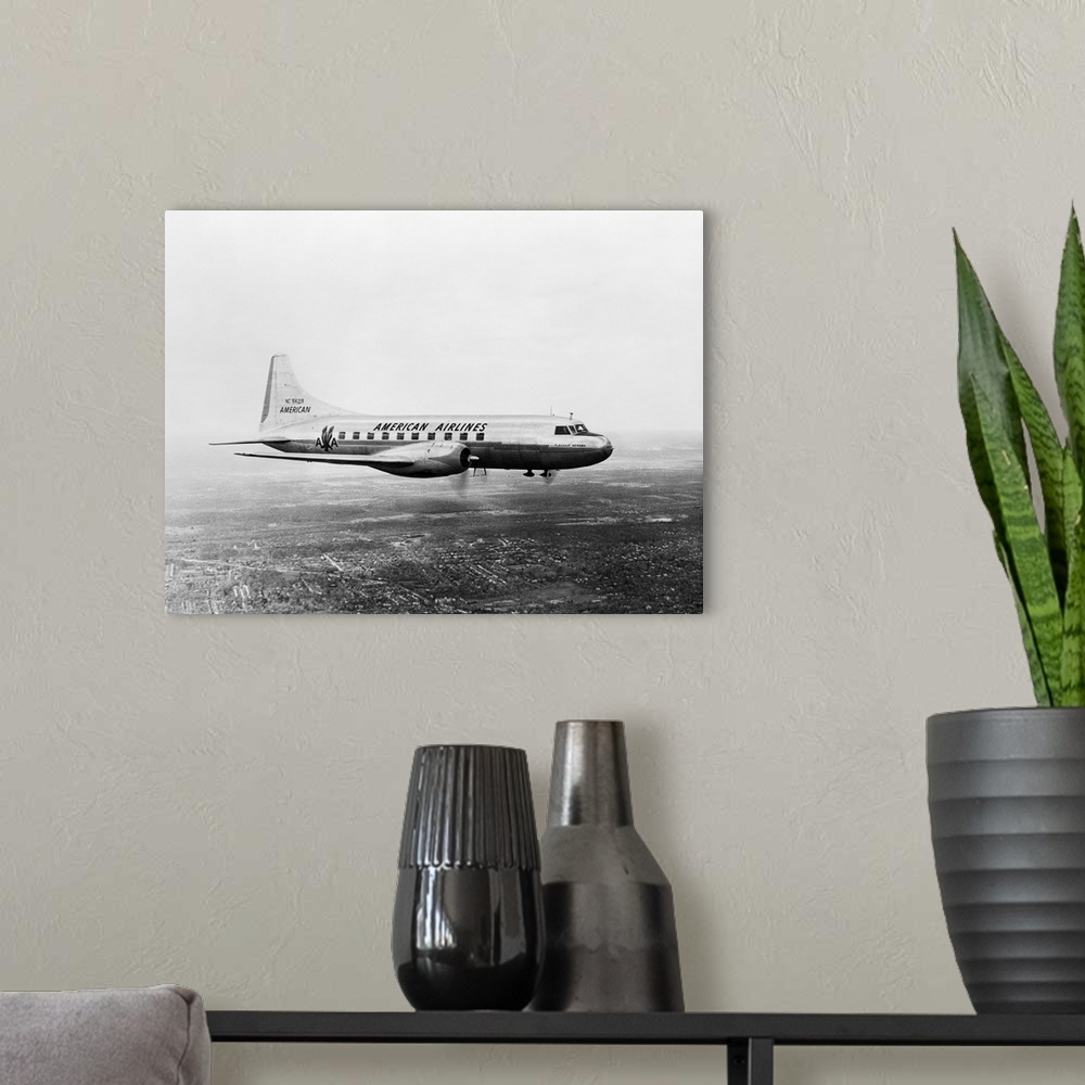 A modern room featuring 1950's American Airlines Convair Flagship Propeller Aircraft In Flight
