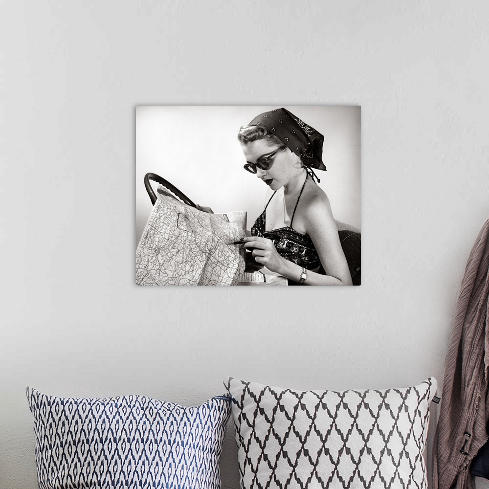 A bohemian room featuring 1950's Woman Wearing Bandana, Sunglasses, And Halter Top Marking Road Map
