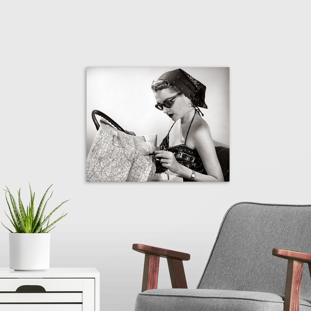 A modern room featuring 1950's Woman Wearing Bandana, Sunglasses, And Halter Top Marking Road Map
