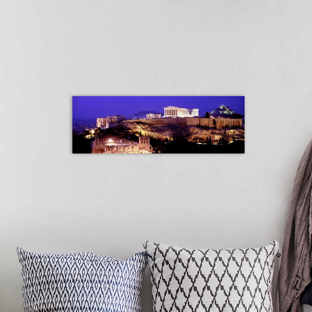 A bohemian room featuring Panoramic photograph of ancient citadel that contains several remains of ancient buildings with h...