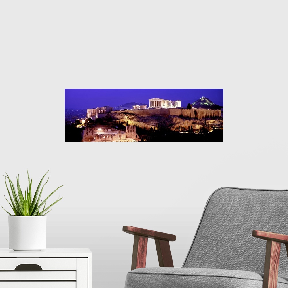 A modern room featuring Panoramic photograph of ancient citadel that contains several remains of ancient buildings with h...