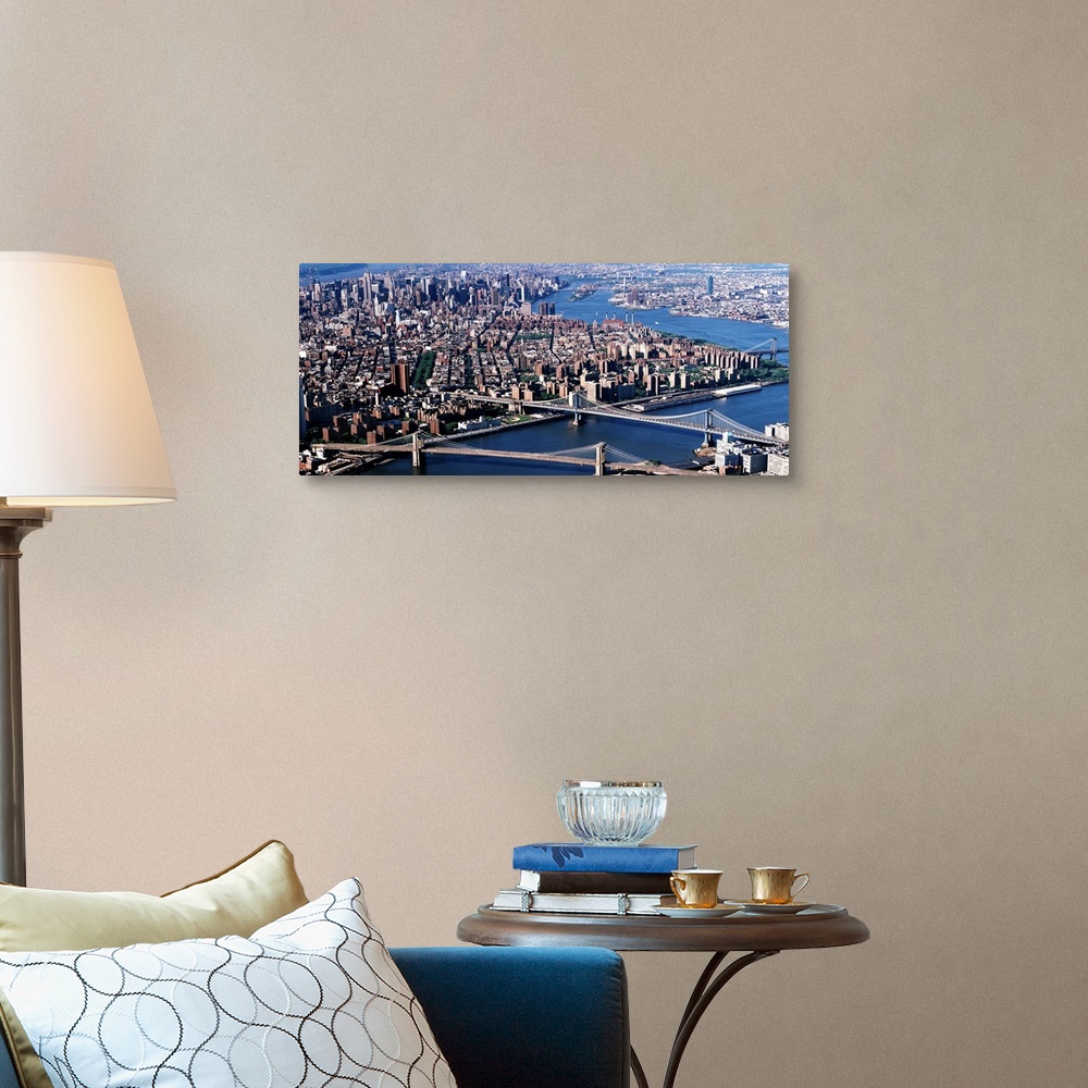 A traditional room featuring Aerial panorama of suspension bridges and bustling New York City metropolis.