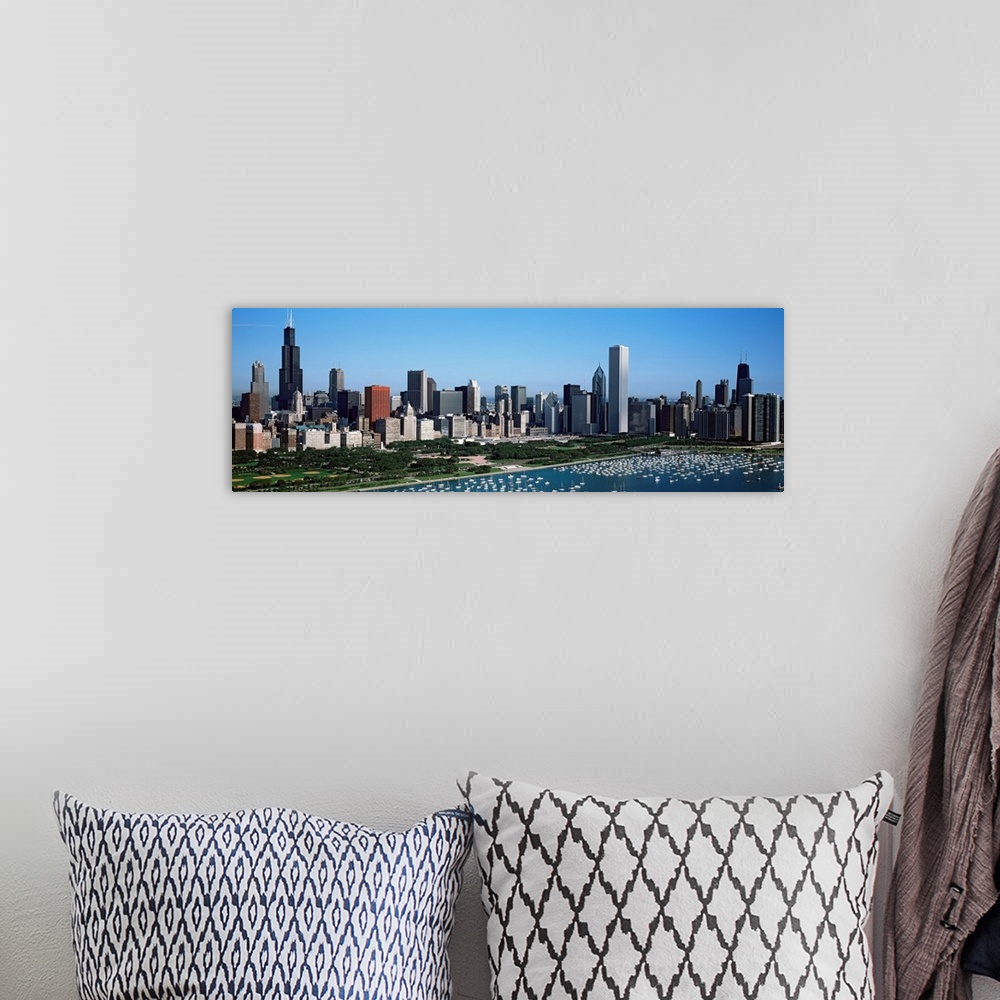 A bohemian room featuring This panoramic photograph shows the city skyline and a crowded harbor on the lake on a sunny clou...