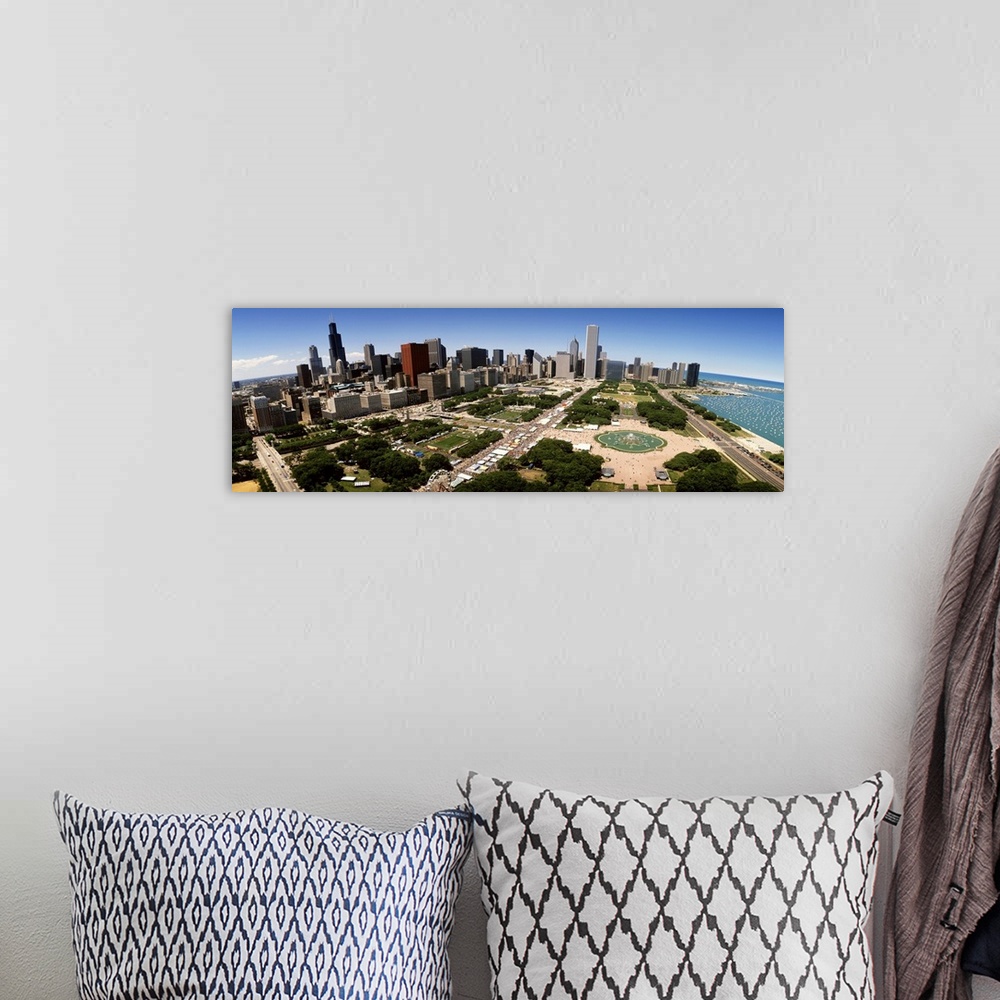 A bohemian room featuring The Chicago skyline and Grant Park are photographed from an aerial view with a wide angle lens.