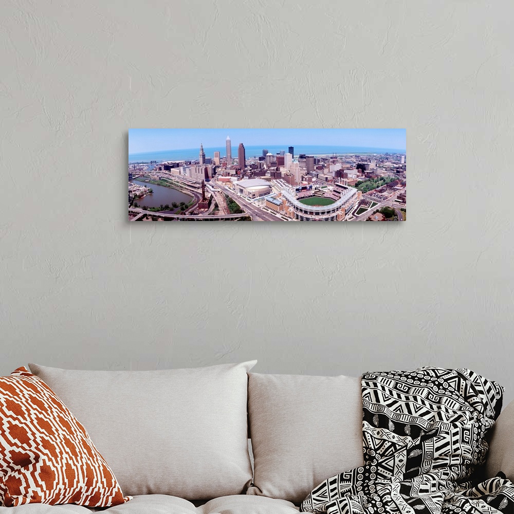 A bohemian room featuring Wide angle aerial photograph of downtown, Lake Erie, and stadium.
