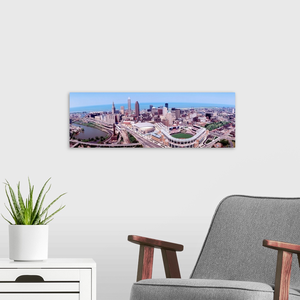 A modern room featuring Wide angle aerial photograph of downtown, Lake Erie, and stadium.