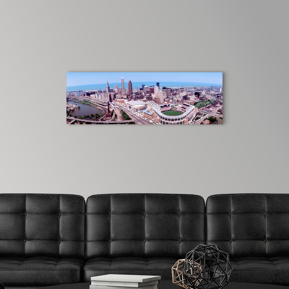 A modern room featuring Wide angle aerial photograph of downtown, Lake Erie, and stadium.