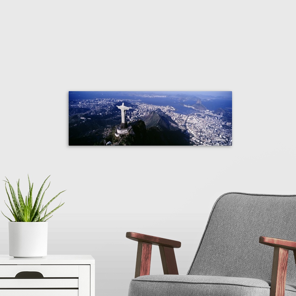 A modern room featuring Panoramic photograph taken from behind the famous Christ the Redeemer statue that is overlooking ...