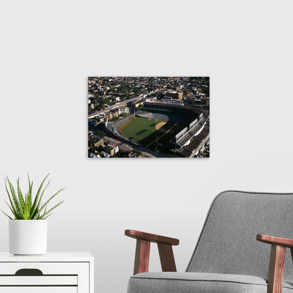 A modern room featuring Big, horizontal, aerial photograph of Wrigley Field in the sunlight, surrounded by the city, in C...