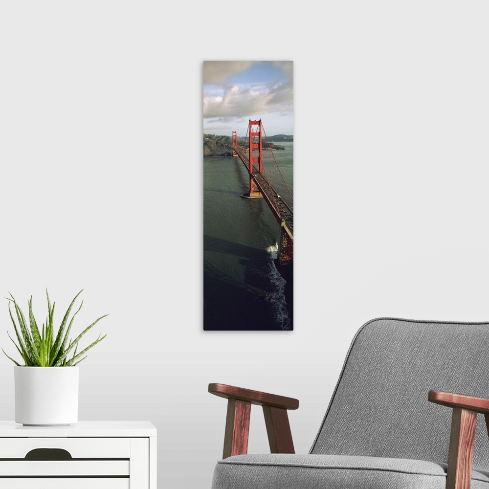 A modern room featuring This tall vertical panoramic picture is taken from above the Golden Gate Bridge looking down the ...