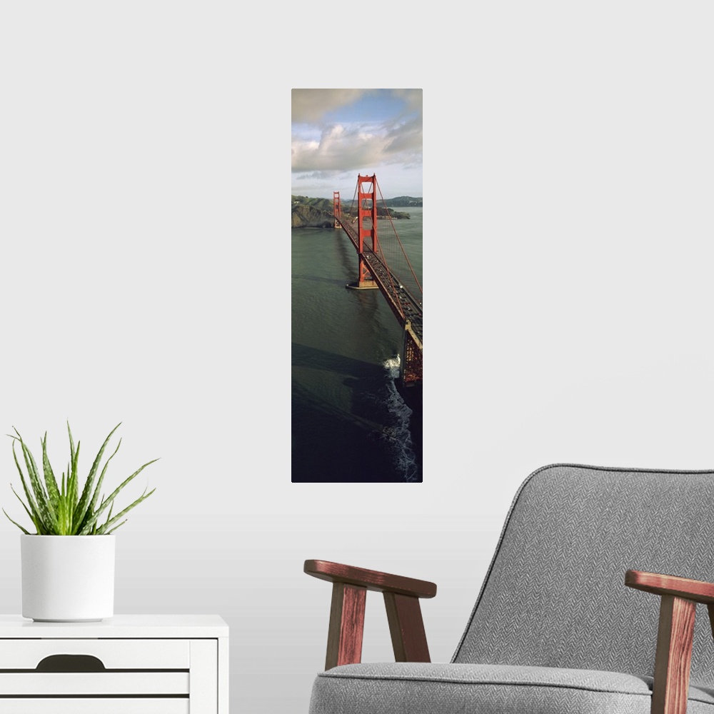 A modern room featuring This tall vertical panoramic picture is taken from above the Golden Gate Bridge looking down the ...