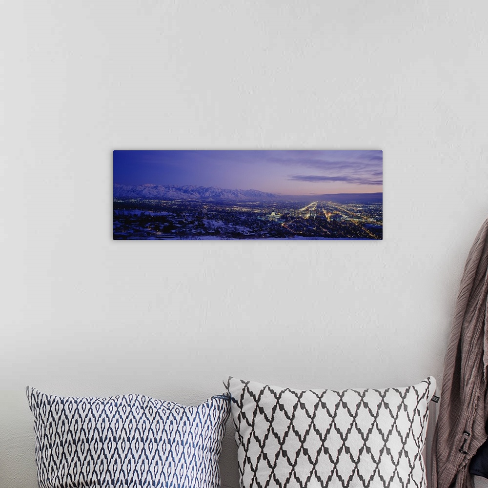 A bohemian room featuring Aerial panorama of Salt Lake City lights at dusk.