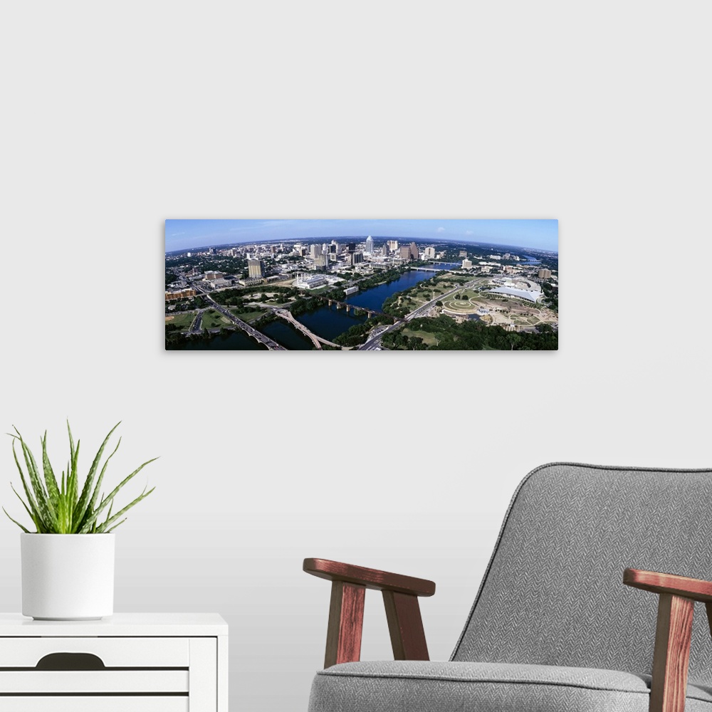 A modern room featuring Wide photo from above of the city of Austin, Texas and the Colorado River.