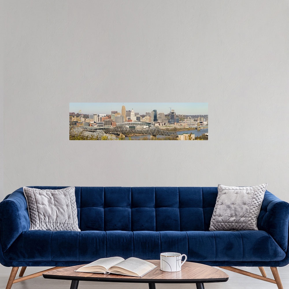 A modern room featuring Panoramic photograph of skyline featuring iconic buildings such as the Carew Tower, PNC Tower, Ci...