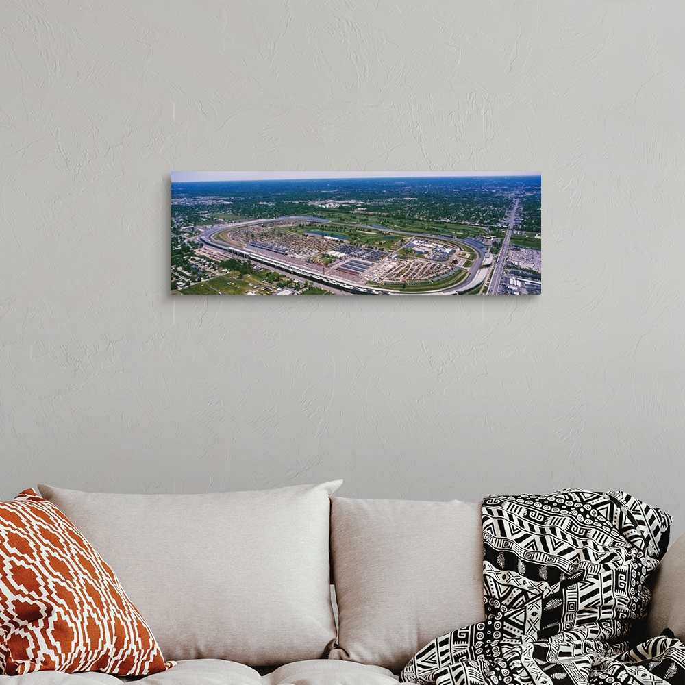 A bohemian room featuring Motorsport arena in a flat Midwestern landscape, straight roads intersecting green patches and su...