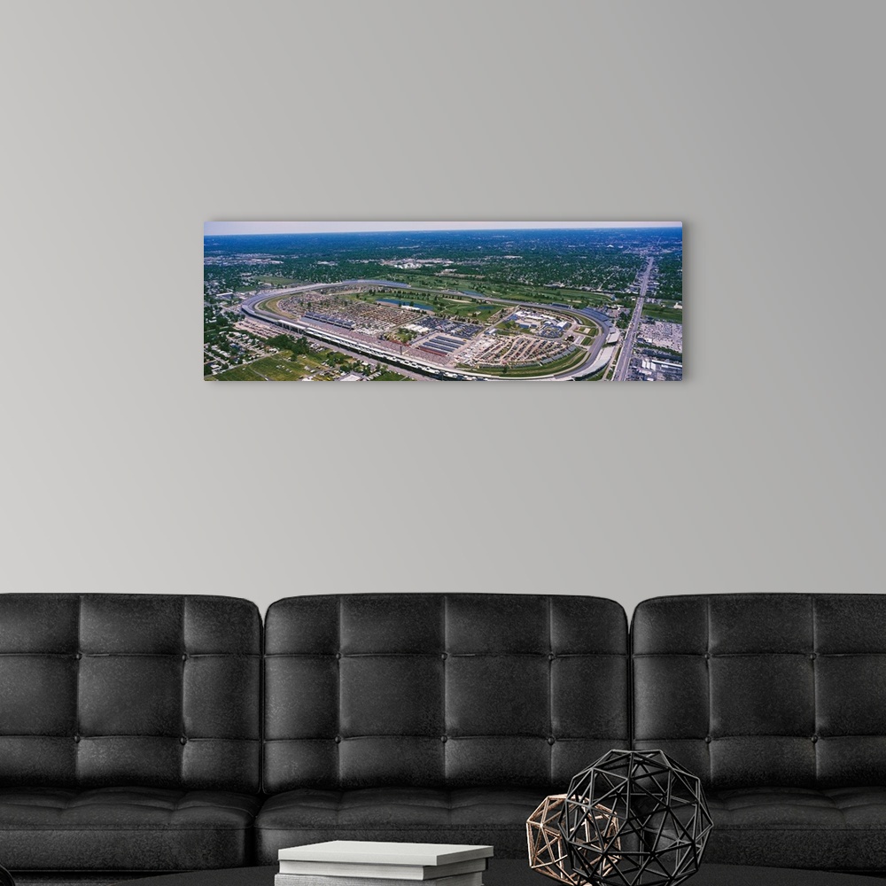 A modern room featuring Motorsport arena in a flat Midwestern landscape, straight roads intersecting green patches and su...
