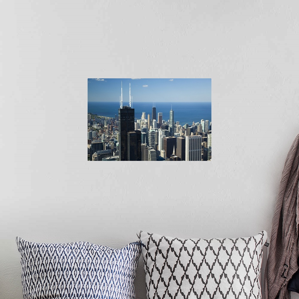 A bohemian room featuring This is an urban landscape showing a view of the city and lake from above on a clear and sunny day.