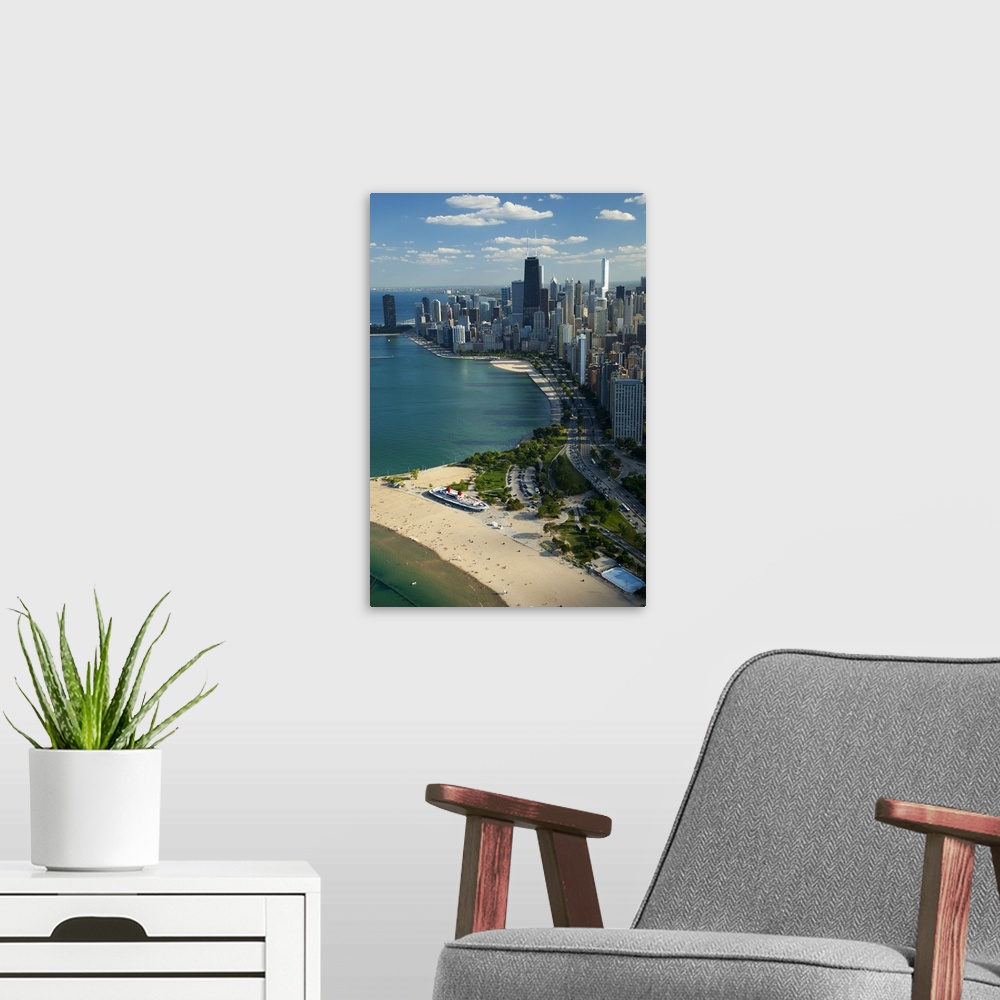 A modern room featuring Big vertical aerial view of the city of Chicago in Cook County, Illinois (IL). People relaxing an...