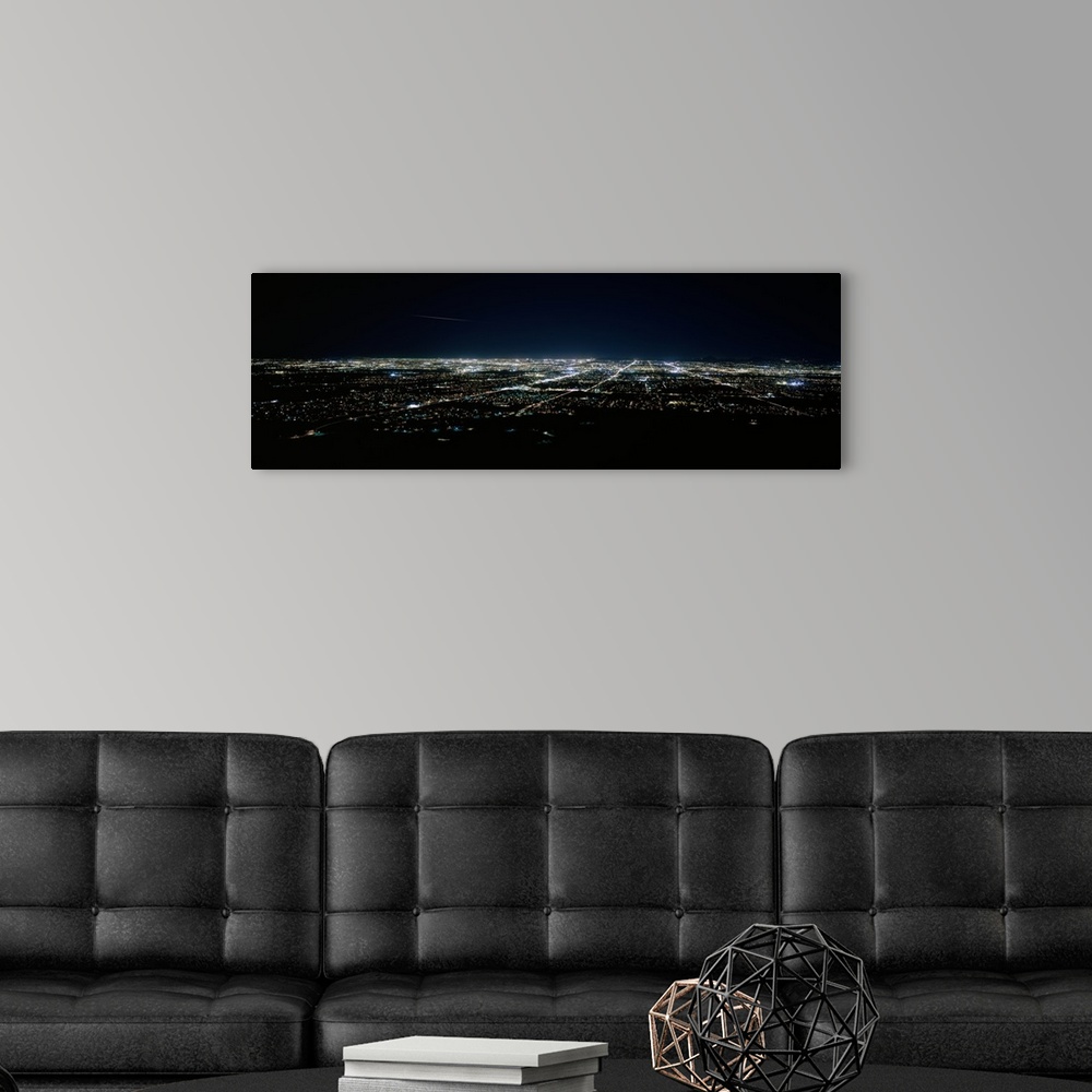 A modern room featuring Aerial view of a city lit up at night, Phoenix, Maricopa County, Arizona