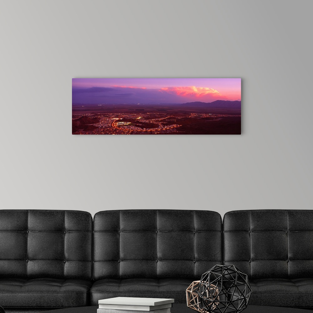 A modern room featuring Aerial view of a city lit up at sunset, Phoenix, Maricopa County, Arizona,