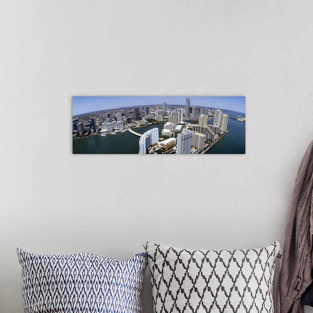 A bohemian room featuring Wide angle photograph of a city skyline filled with skyscrapers, showing the curvature of the earth.