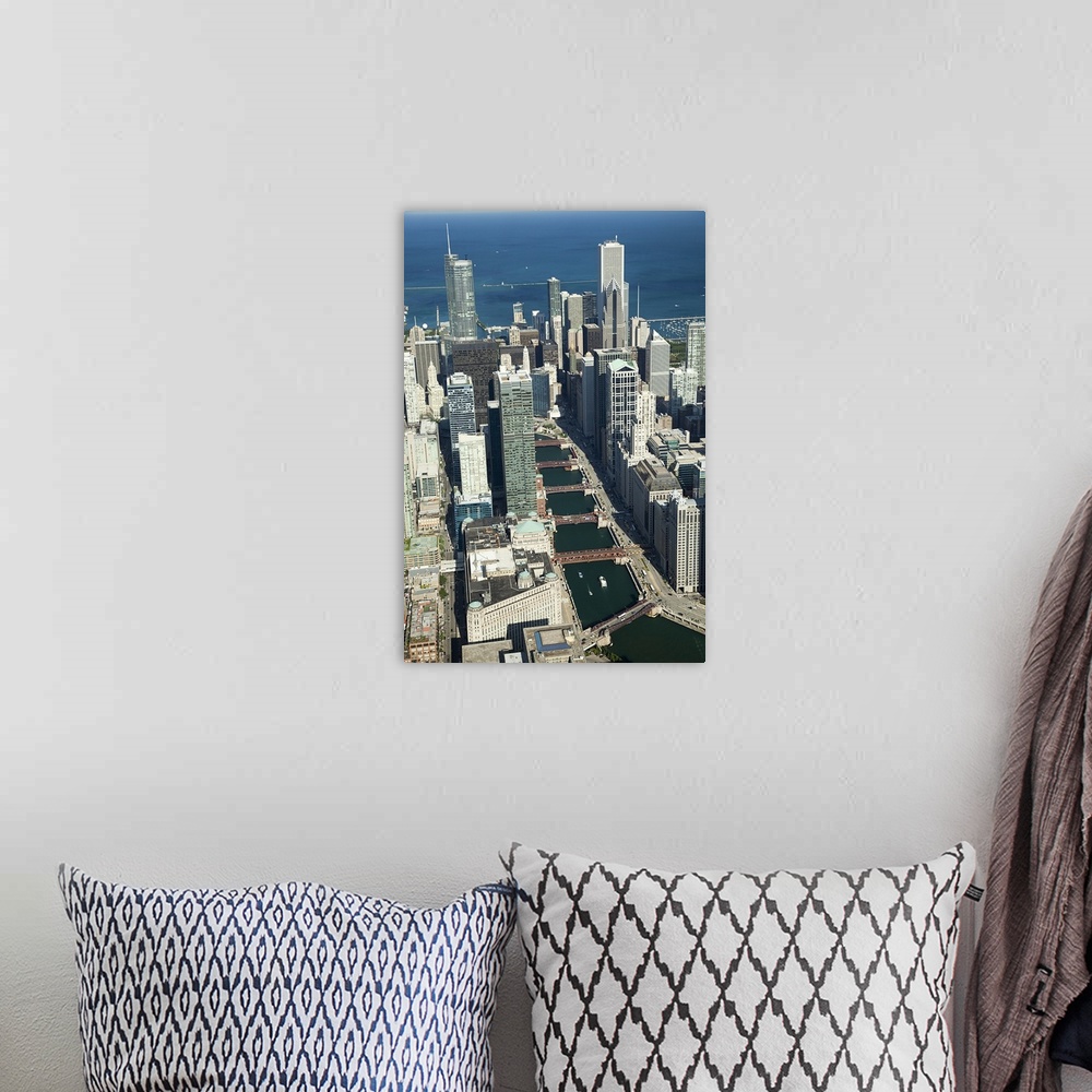 A bohemian room featuring Tall photo print of the Chicago cityscape seen from above with the Chicago River curving through it.