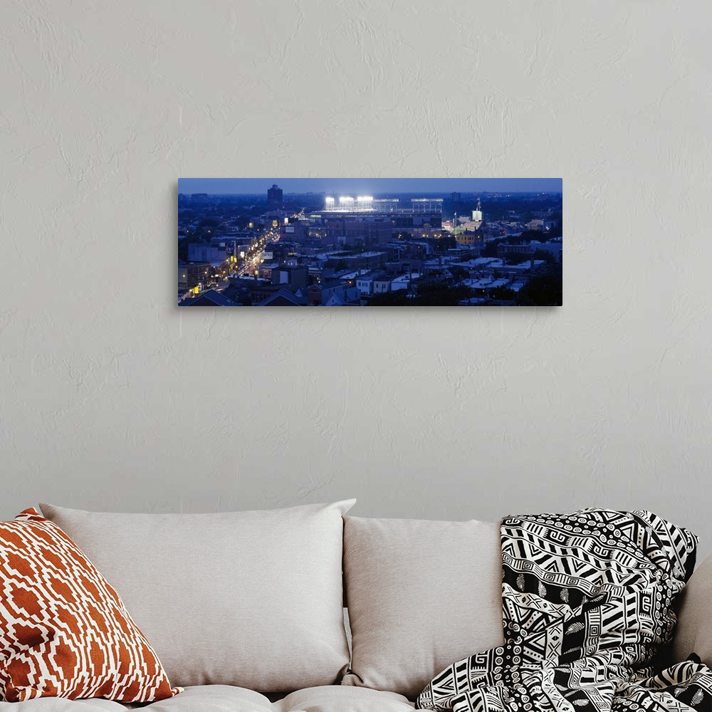 A bohemian room featuring This high angle photograph is taken from a distance but focused on the Chicago Cubs stadium as it...