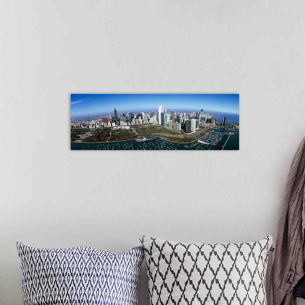 A bohemian room featuring Panoramic photo canvas art of the Chicago cityscape with boats in the harbor seen from above.