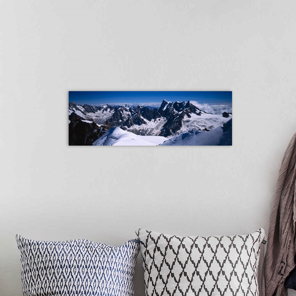 A bohemian room featuring Aerial view of a snow covered mountain range, Mt Blanc, France