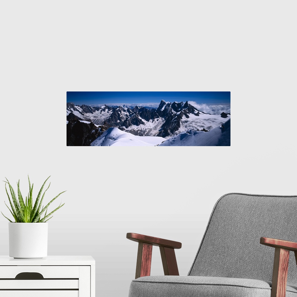 A modern room featuring Aerial view of a snow covered mountain range, Mt Blanc, France