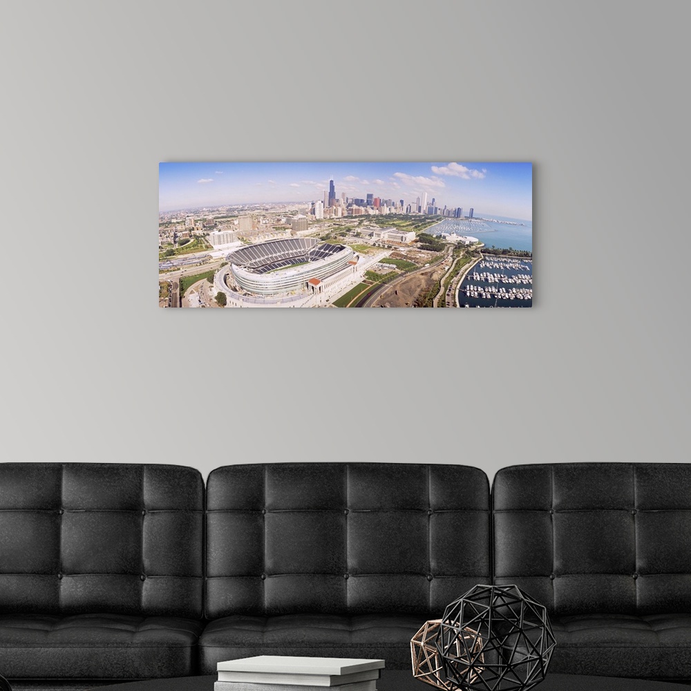 A modern room featuring Vista over the city of Chicago with a clear view of the football stadium, the city skyline, and t...