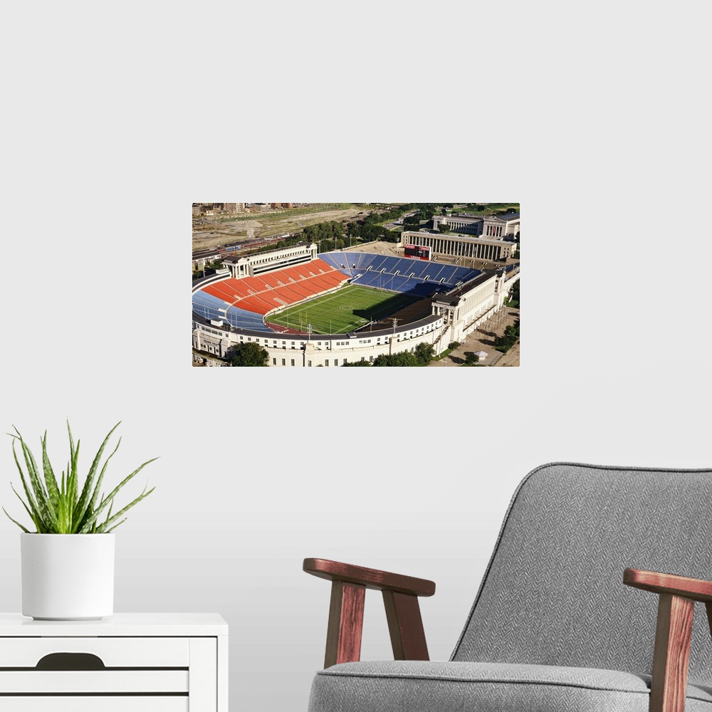 A modern room featuring Photo on canvas of the oldest NFL stadium which home to the Chicago Bears seen from above.