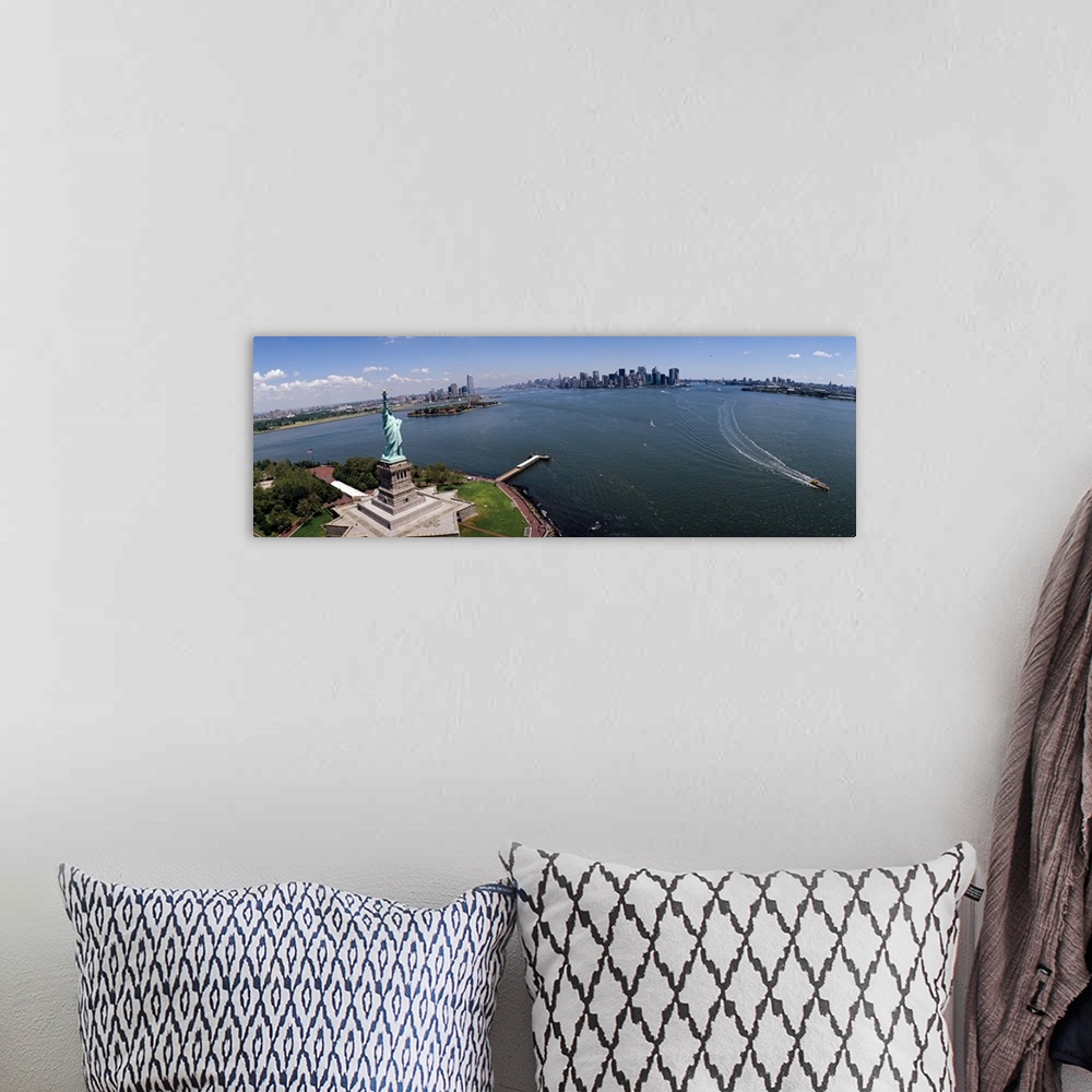 A bohemian room featuring Panoramic photograph of iconic "Big Apple" monument and waterfront under a cloudy sky.