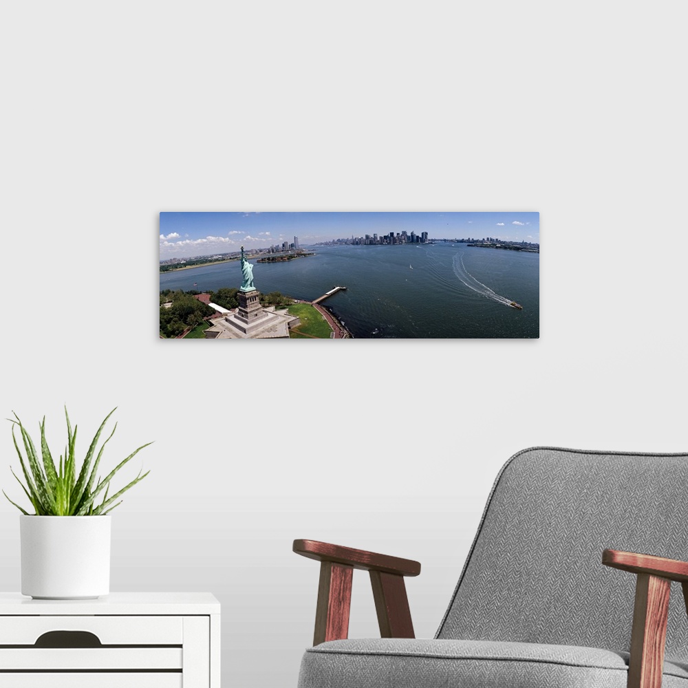 A modern room featuring Panoramic photograph of iconic "Big Apple" monument and waterfront under a cloudy sky.