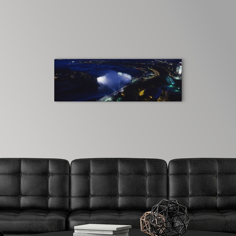 A modern room featuring Aerial view of a waterfall at night, Horseshoe Falls, Niagra Falls, Ontario, Canada