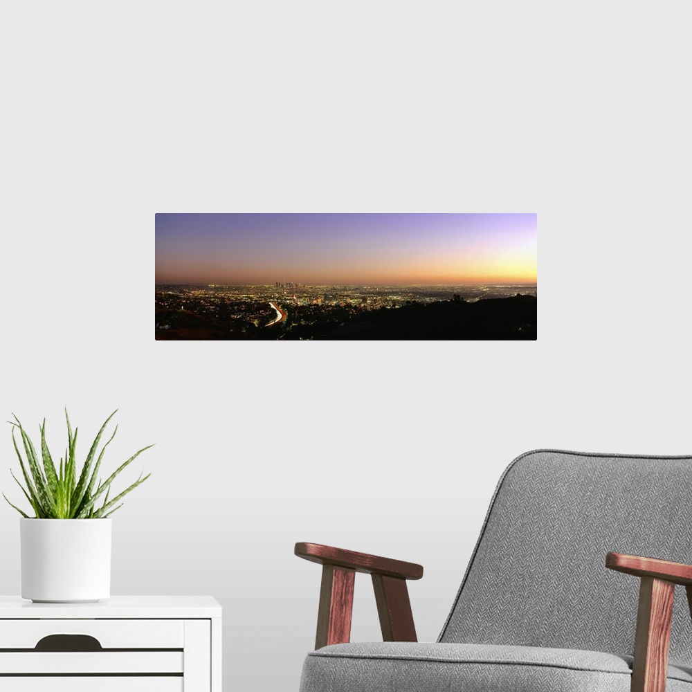 A modern room featuring Aerial view of buildings in a city at dusk from Hollywood Hills, Hollywood, City of Los Angeles, ...