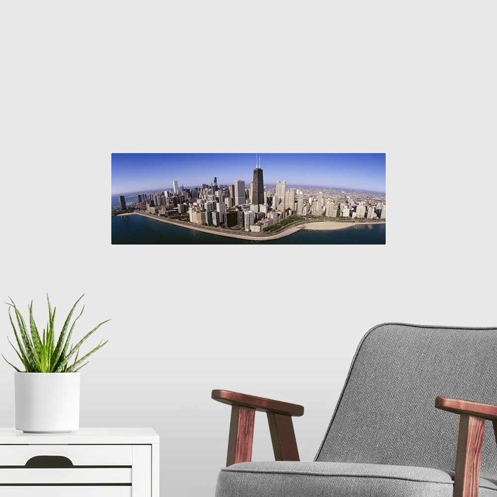 A modern room featuring This wide angle photograph was taken from above the Chicago skyline over Lake Michigan that lines...