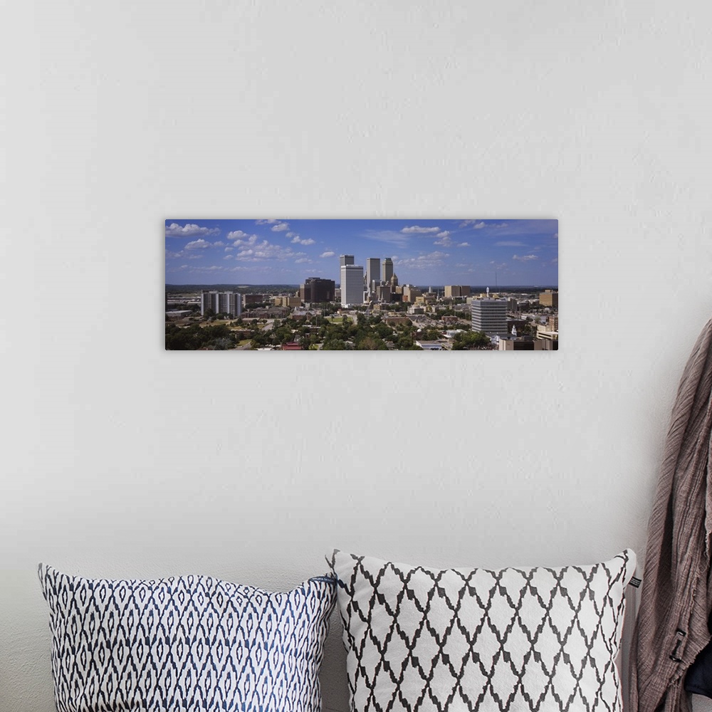 A bohemian room featuring Wide photo of buildings in downtown Tulsa on canvas.