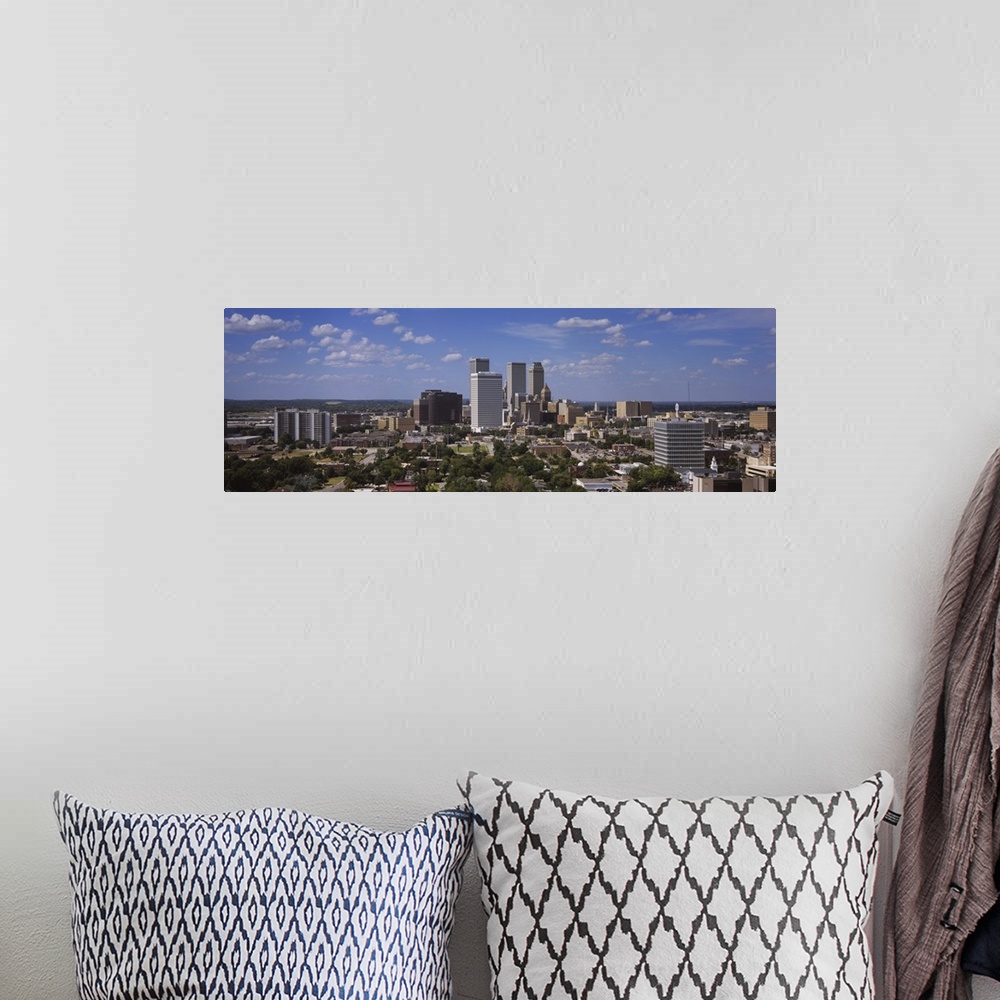 A bohemian room featuring Wide photo of buildings in downtown Tulsa on canvas.
