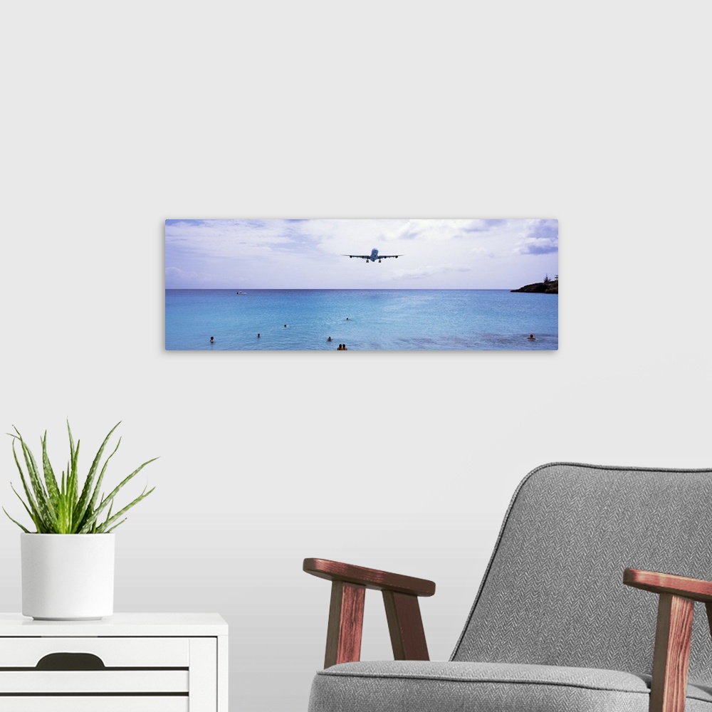 A modern room featuring Airplane flying over the sea, Maho Beach, Sint Maarten, Netherlands Antilles