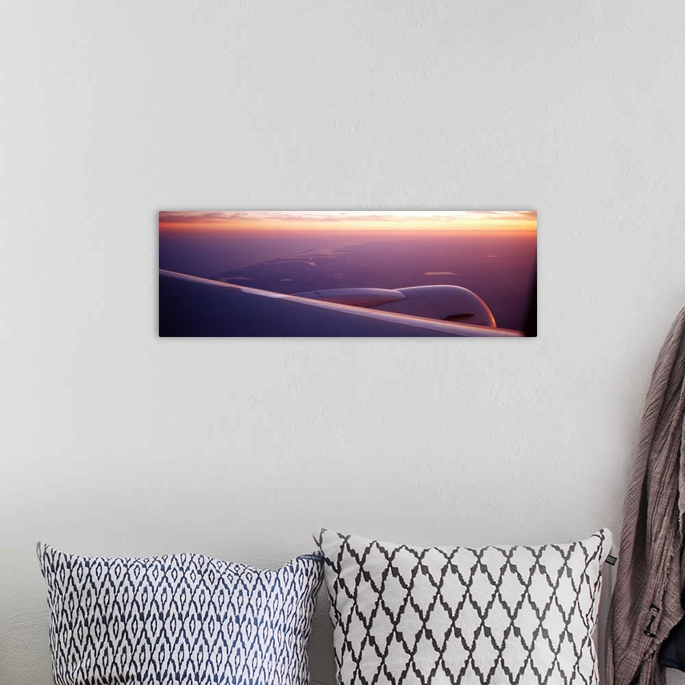 A bohemian room featuring Airplane wing at dusk