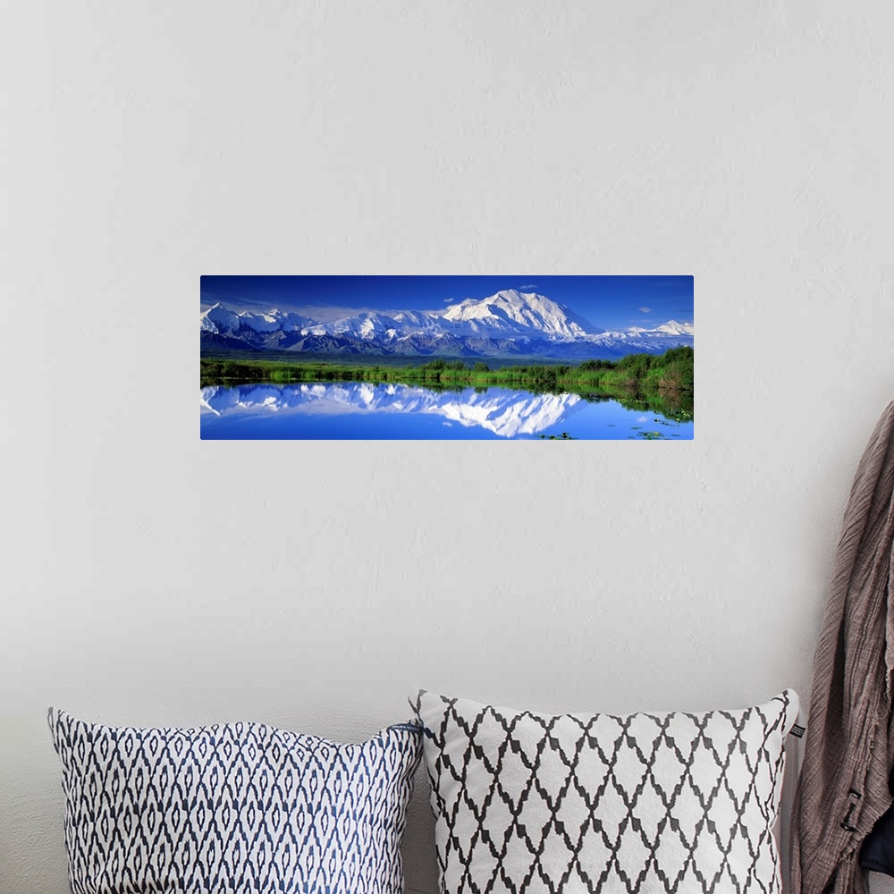 A bohemian room featuring Panoramic view of snowcapped mountains and Mt. McKinley reflecting in still waters.