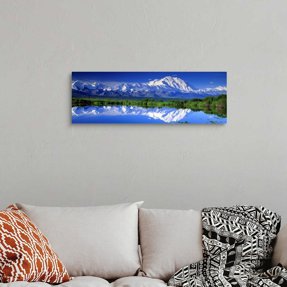 A bohemian room featuring Panoramic view of snowcapped mountains and Mt. McKinley reflecting in still waters.