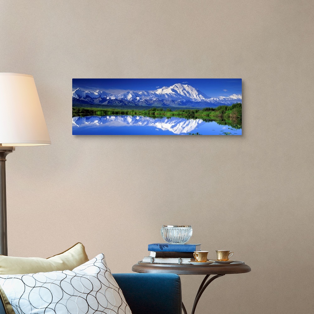 A traditional room featuring Panoramic view of snowcapped mountains and Mt. McKinley reflecting in still waters.