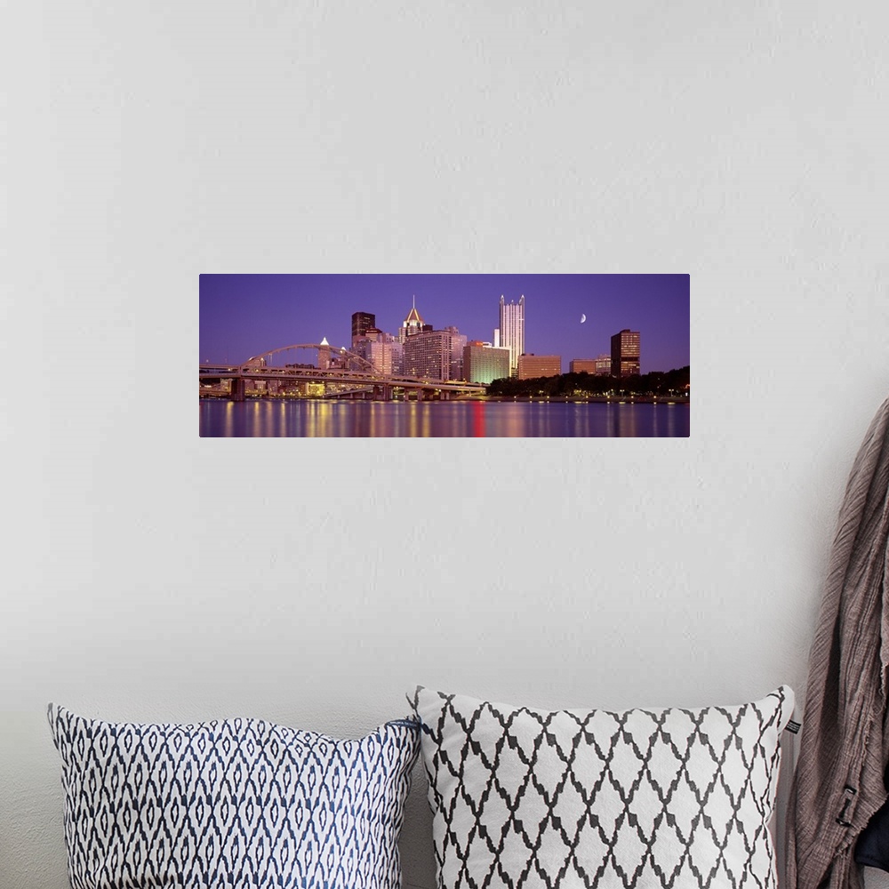 A bohemian room featuring Panoramic view of the bridge and city buildings in Pittsburgh, Pennsylvania, at night, with blurr...
