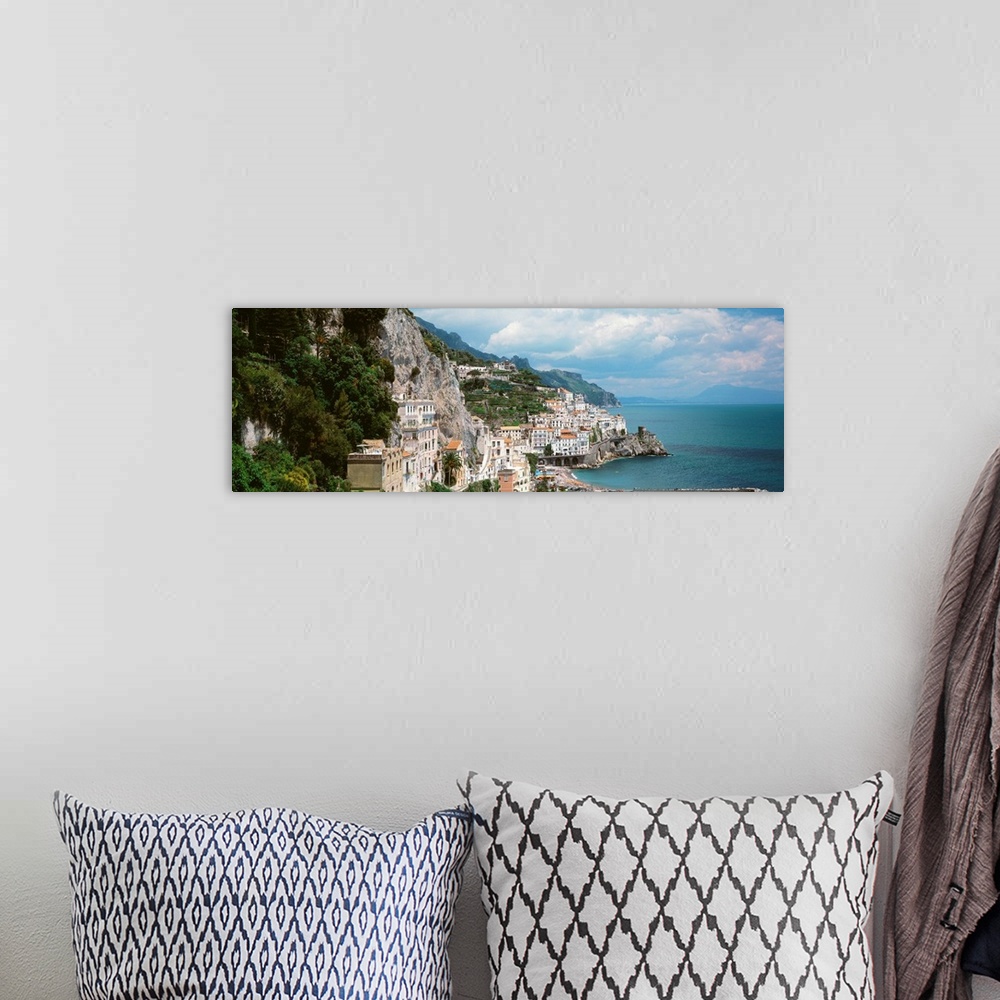 A bohemian room featuring Wide angle photograph taken of buildings that sit in the mountains and line the ocean coast in It...