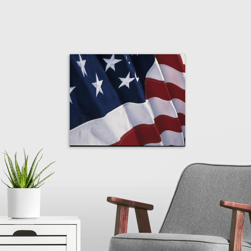A modern room featuring Close-up photograph of a rippling flag of the United States of America.
