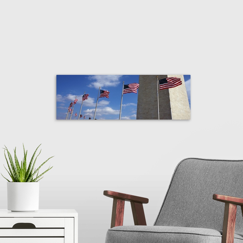 A modern room featuring American flags in front of an obelisk Washington Monument Washington DC