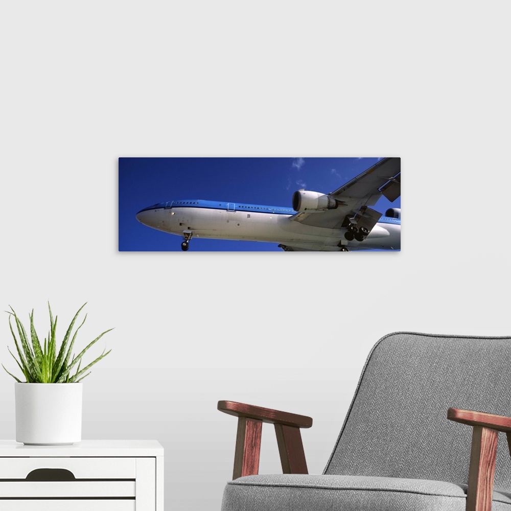 A modern room featuring An airplane in flight, Princess Juliana International Airport, Maho Beach, Sint Maarten, Netherla...